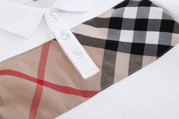 96feee43 Stylish and Comfortable: Boy's Devon Check Panel Short-Sleeve White Polo
